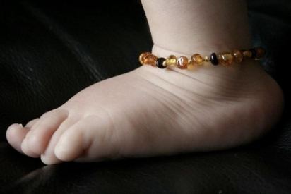 baltic amber teething anklet on baby ankle for nightime teething relief