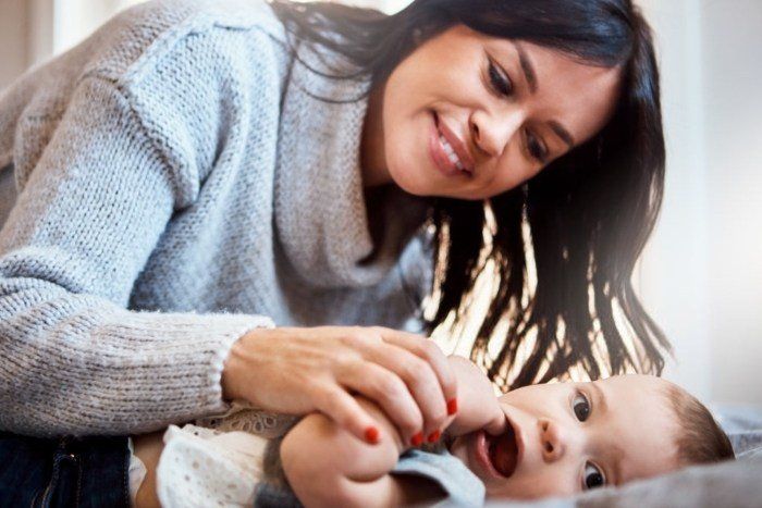 mom trying to soothe baby just started teething